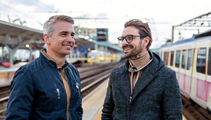 businessmen at train station - company card